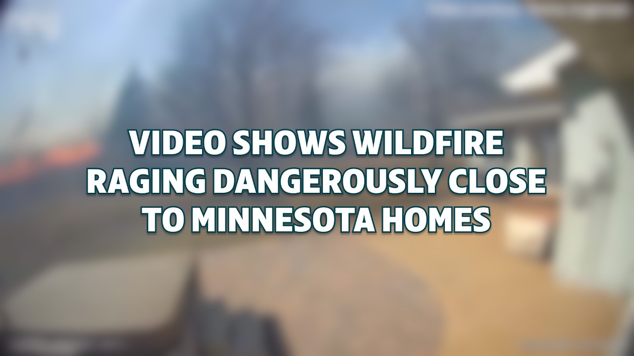 Dramatic video catches wildfire raging dangerously close to Minnesota homes.